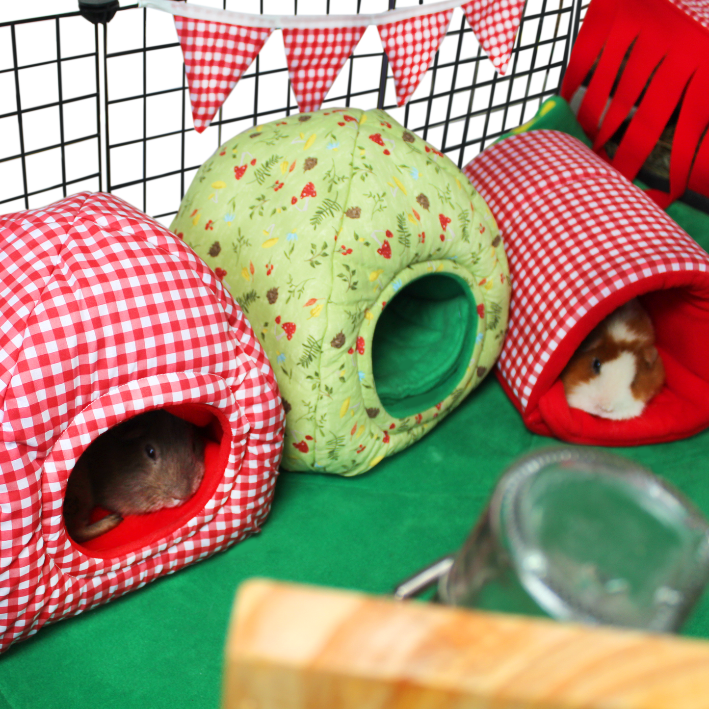 Red Gingham Snuggle Tunnel, showing the guinea pig tunnel in use in a picnic themed caged set up