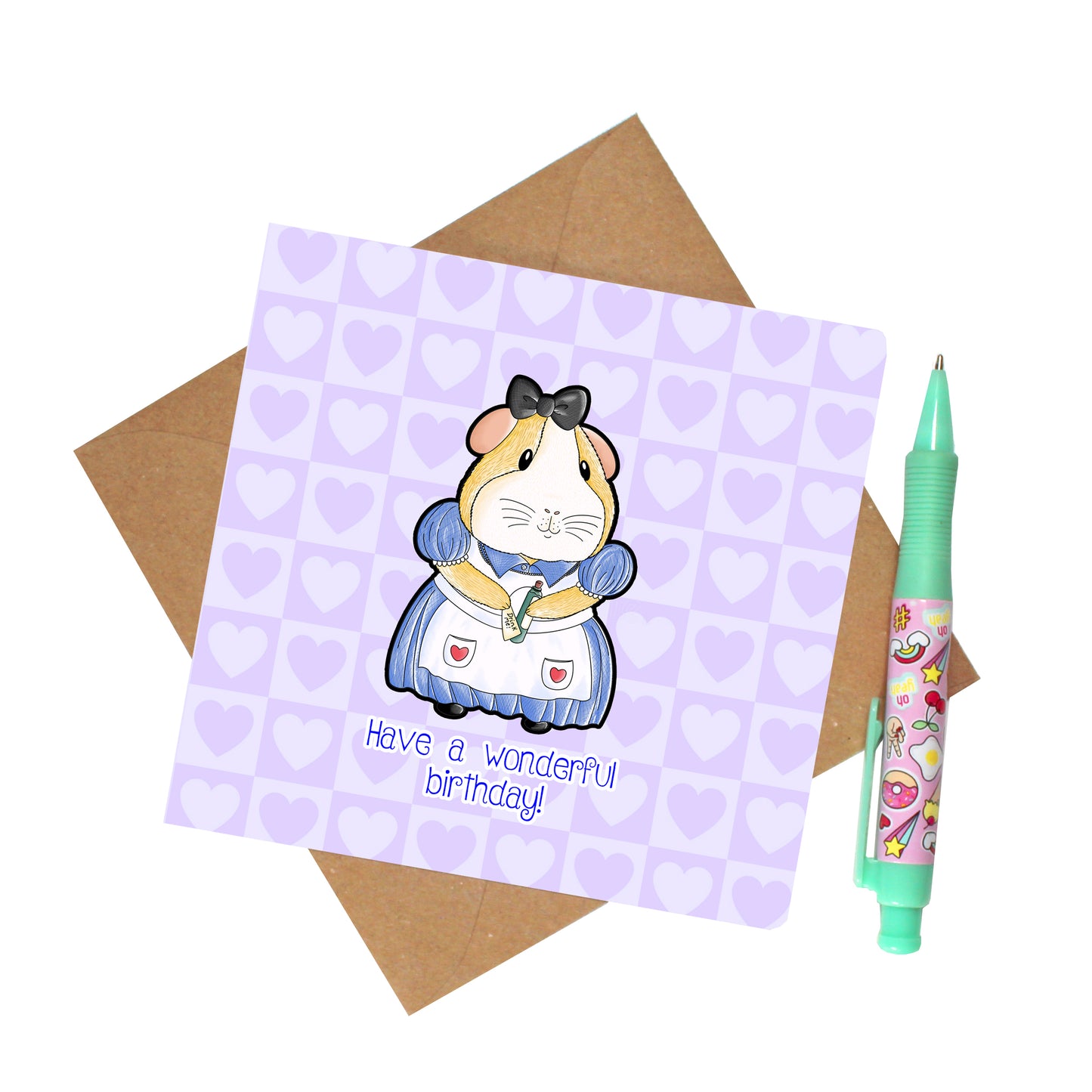 Alice In Piggy Land - Guinea Pig Birthday Card, top view of the card with recycled envelope