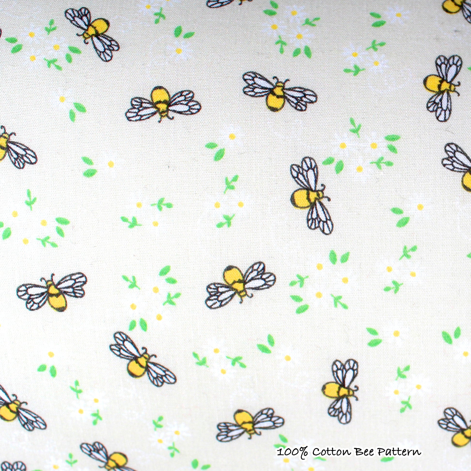 Yellow Bee Pattern Snuggle Tunnel, close up view of the bee pattern cotton outer layer