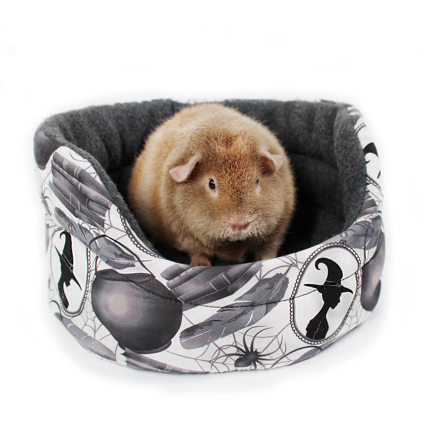 Small animal in a patterned pet bed with Halloween design
