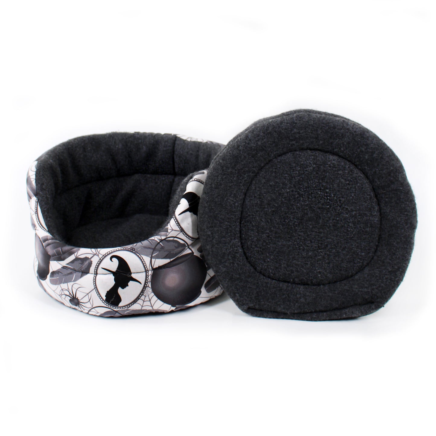 Black pet bed with a spider web design on a white background