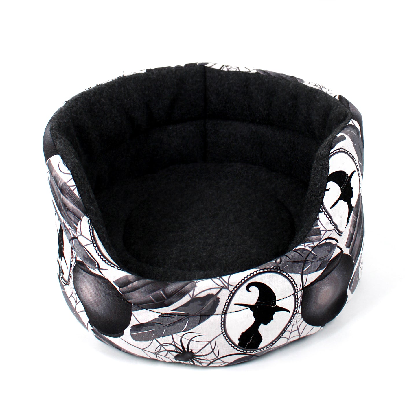 Halloween-themed pet bed with black and white design on a white background