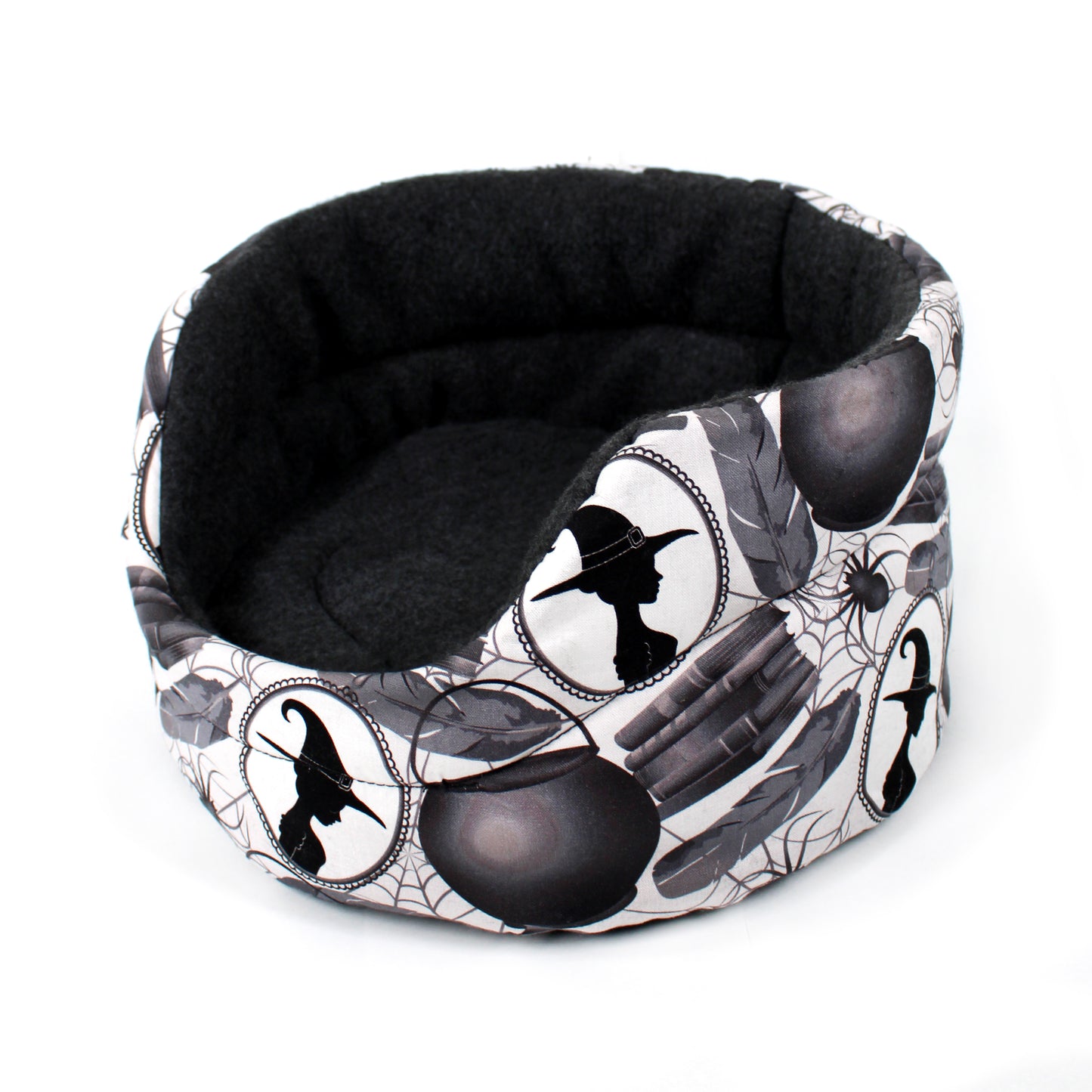 Halloween-themed pet bed with black and white design on a white background