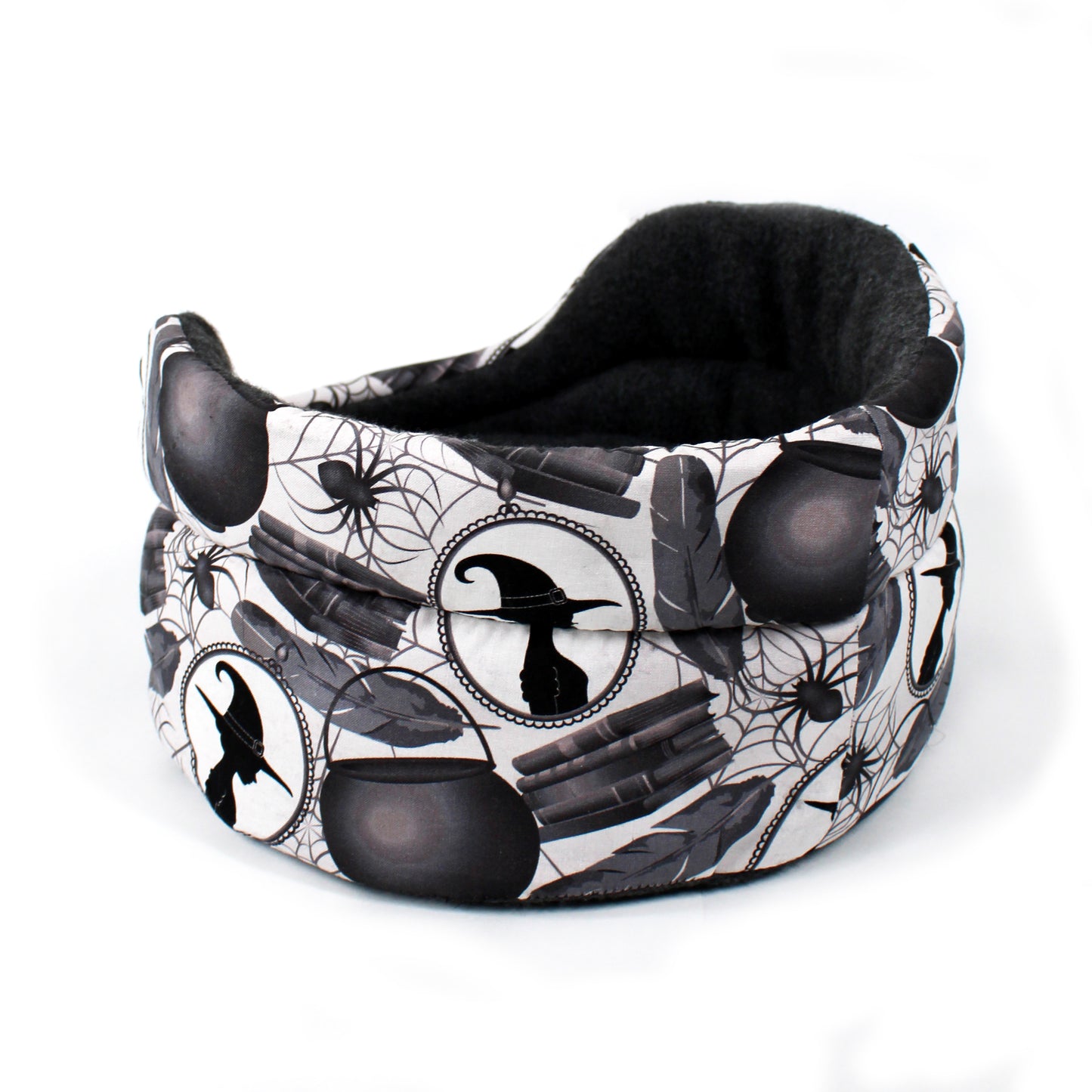 Black and white patterned pet bed with Halloween-themed design on a white background