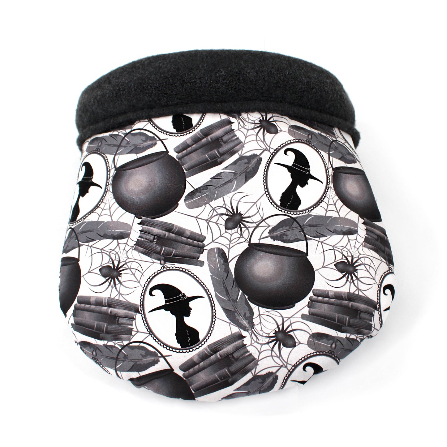 cuddle sack with a Halloween-themed pattern featuring witches, cauldrons, and books on a white background.
