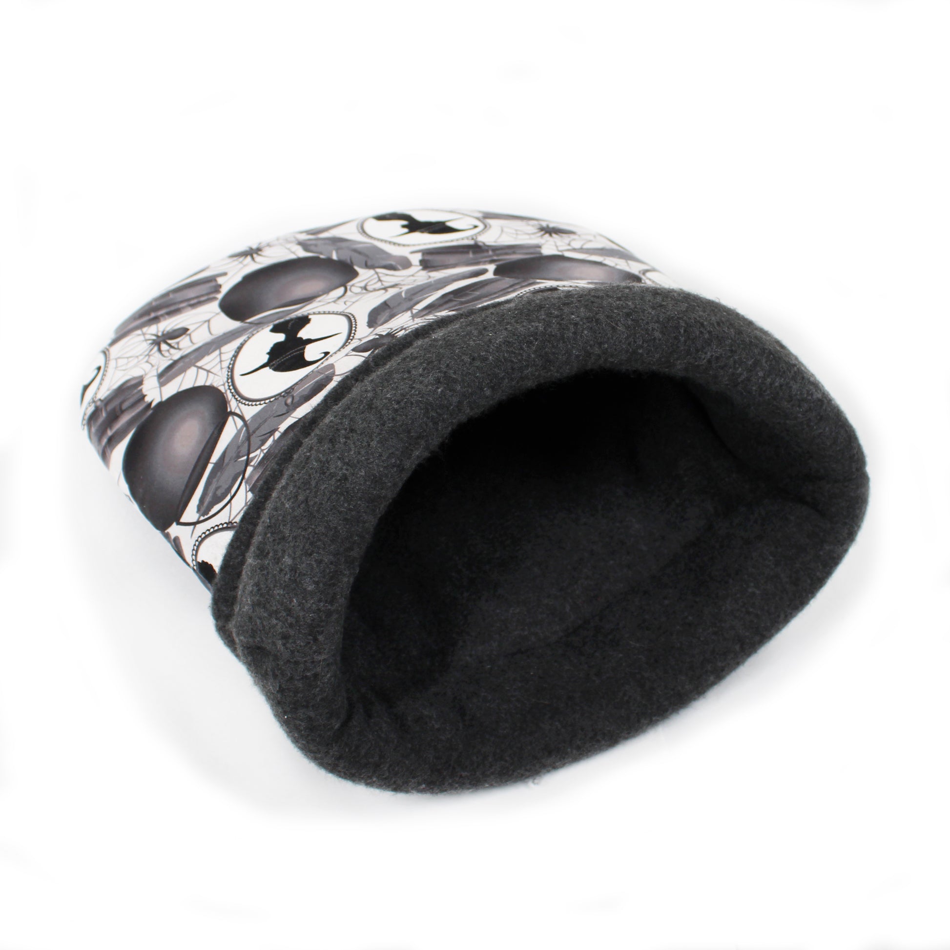 Black pet bed with white pattern on a white background