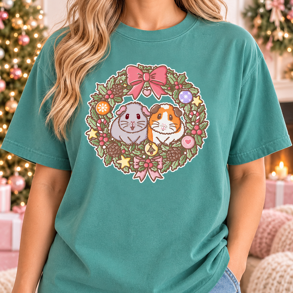 Model wearing the Seafoam green T-shirt featuring the Christmas wreath illustration.