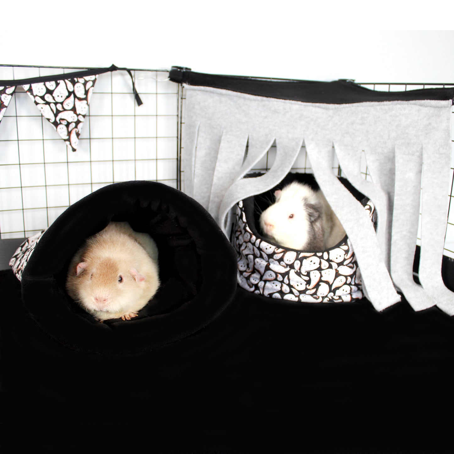 Grey and Black Corner Fleece Forest, over a ghost cuddle cup bed adding to the Halloween theme of the guinea pig cage
