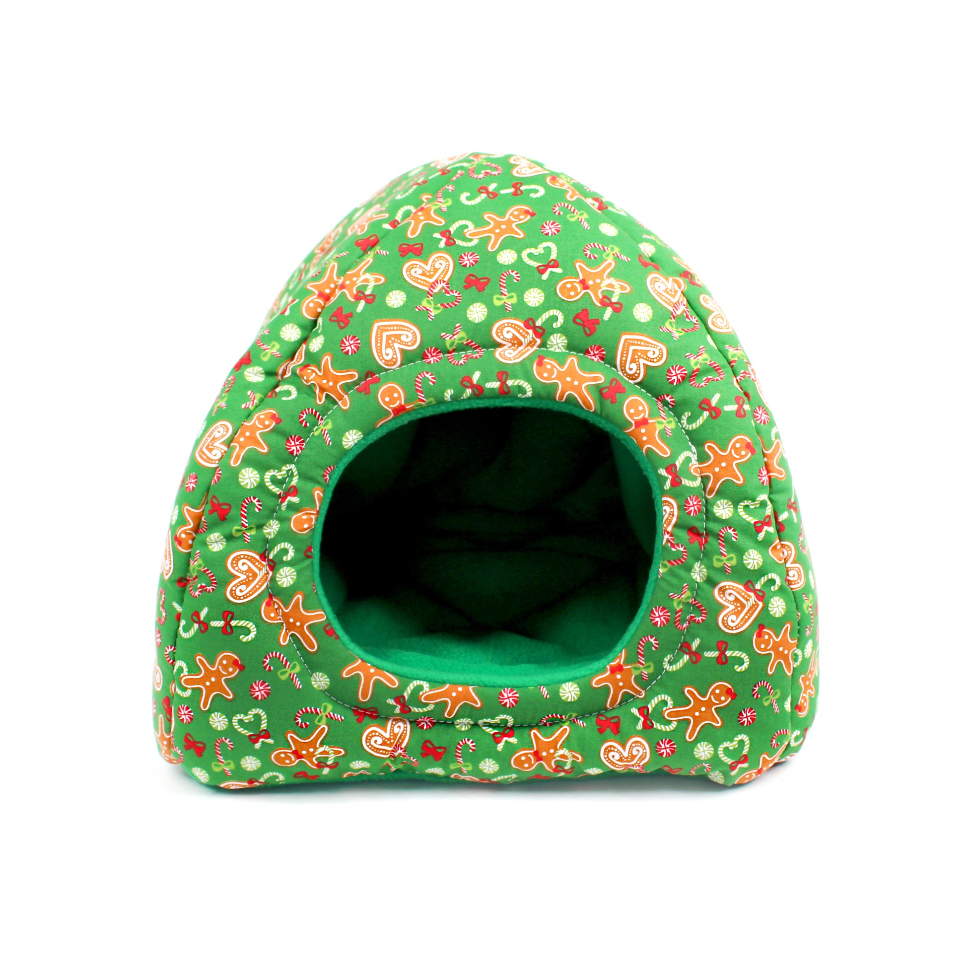 Green pet bed with gingerbread man pattern on a white background