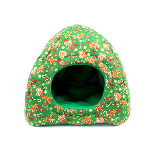 Green pet bed with gingerbread man pattern on a white background