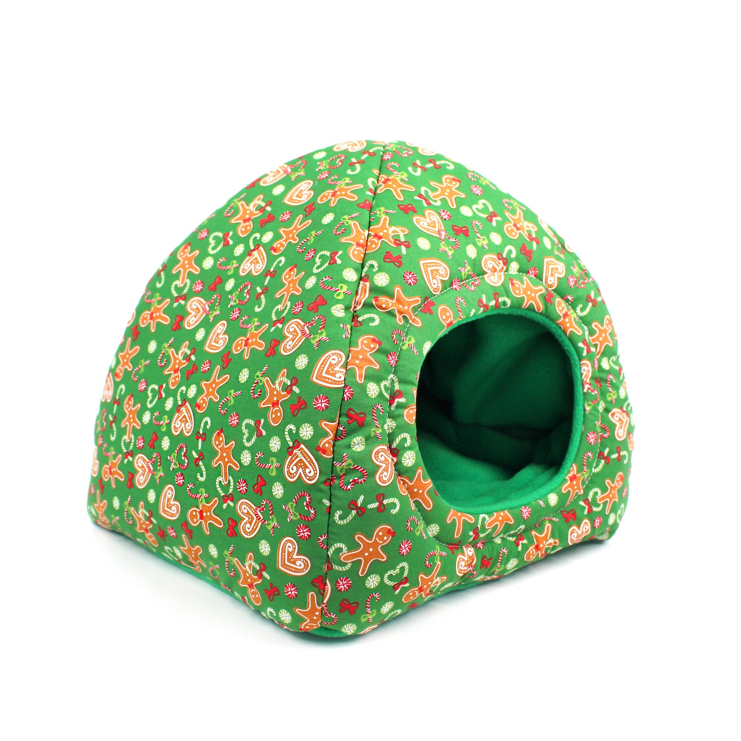 Green pet bed with gingerbread man pattern on a white background