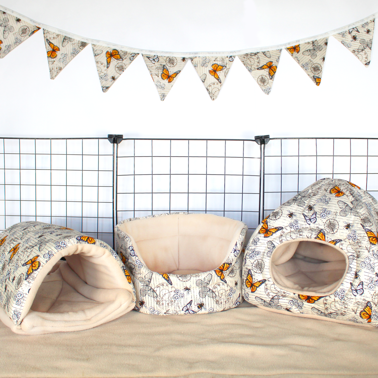 Large Steampunk Butterfly Bunting, hanging on a wall above a guinea pig Cage
