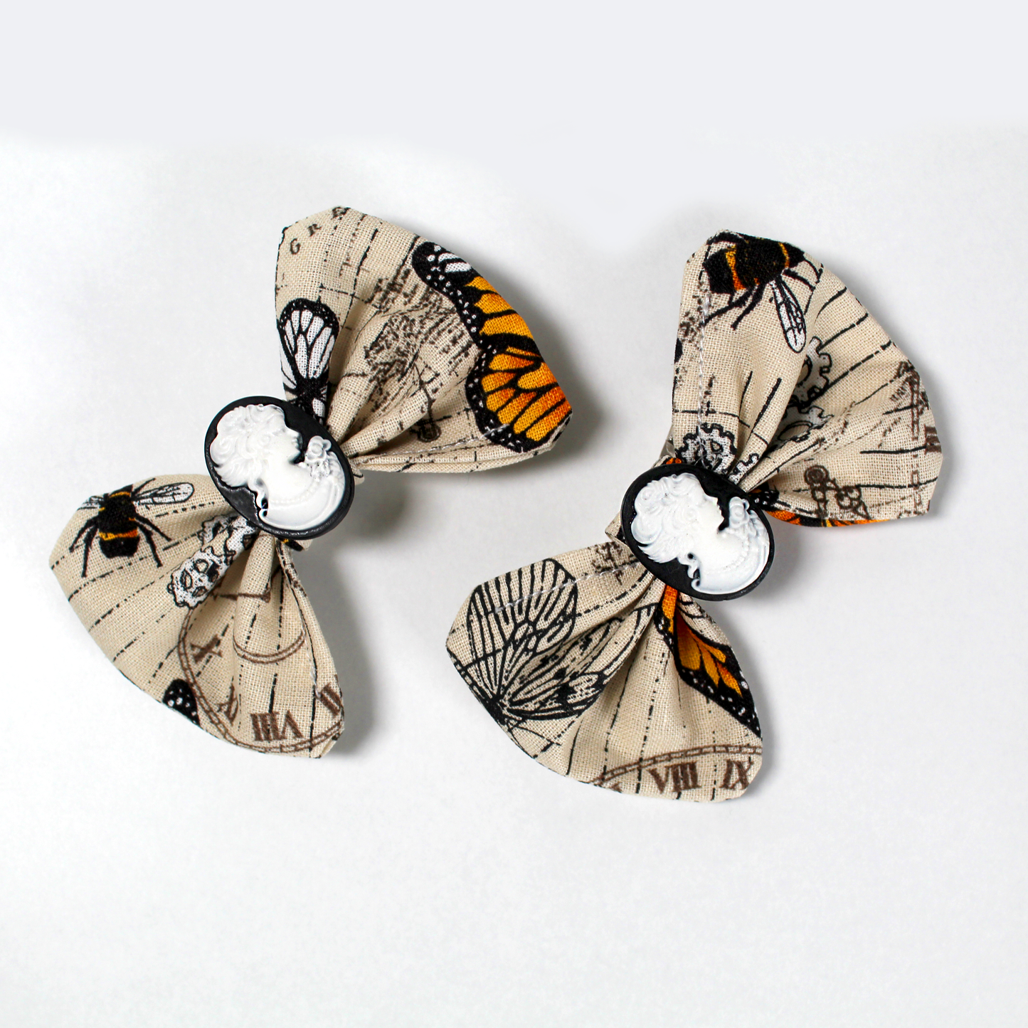Pair Of Steampunk Butterfly Hair Bows, close up view of the hair clips showing the details