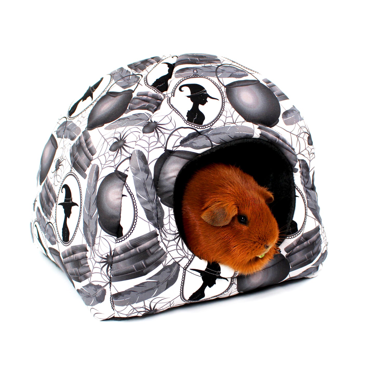 Small animal house with Halloween design featuring a hamster inside on a white background