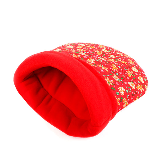 Red pet bed with a patterned top on a white background