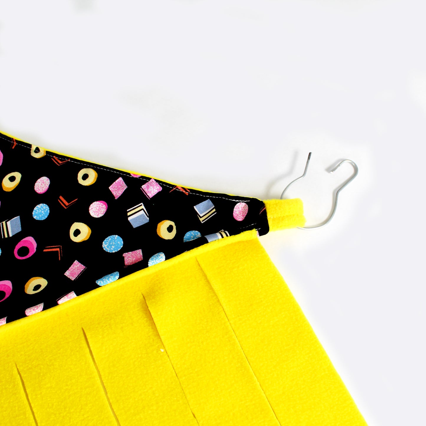 Liquorice Allsorts Corner Fleece Forest for Guinea Pigs, close up showing the loops and metal clips