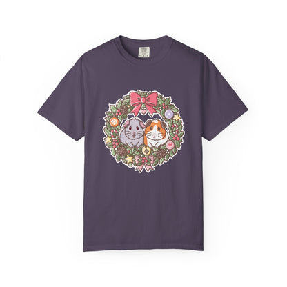 Dark purple Christmas guinea pig T-shirt featuring the festive wreath illustration.