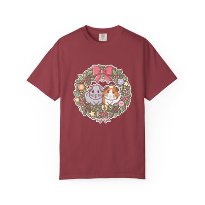 Wine-coloured Christmas T-shirt featuring the festive guinea pig wreath illustration.