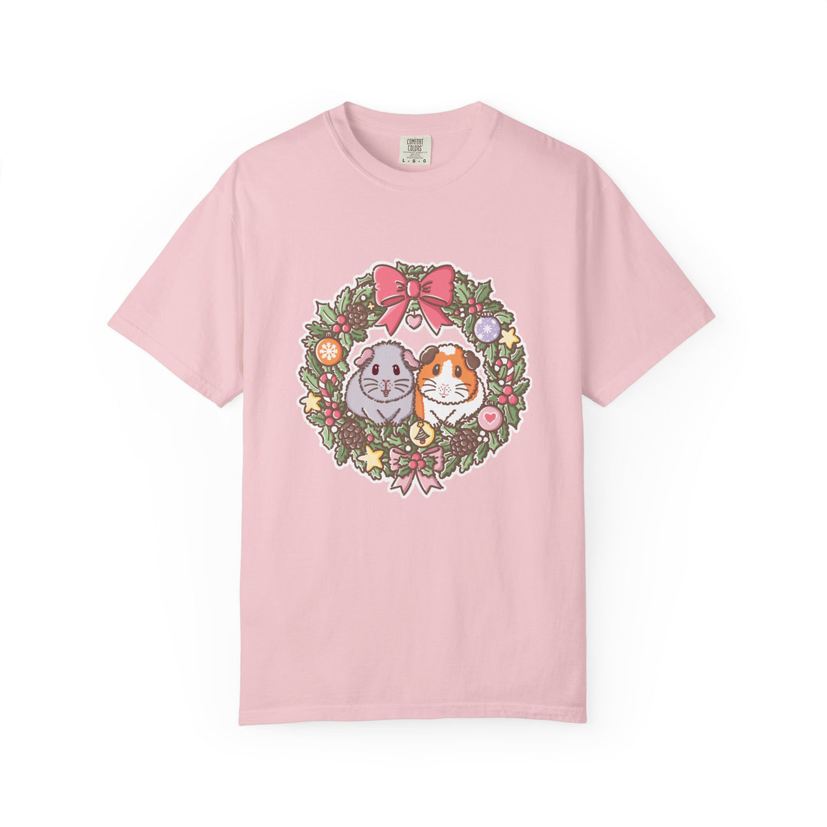 Pale pink Comfort Colors T-shirt featuring Earl Grey and Teacake guinea pigs inside a festive Christmas wreath illustration.