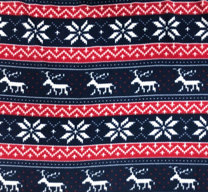 Festive fabric pattern with reindeer and snowflakes in red, white, and blue.