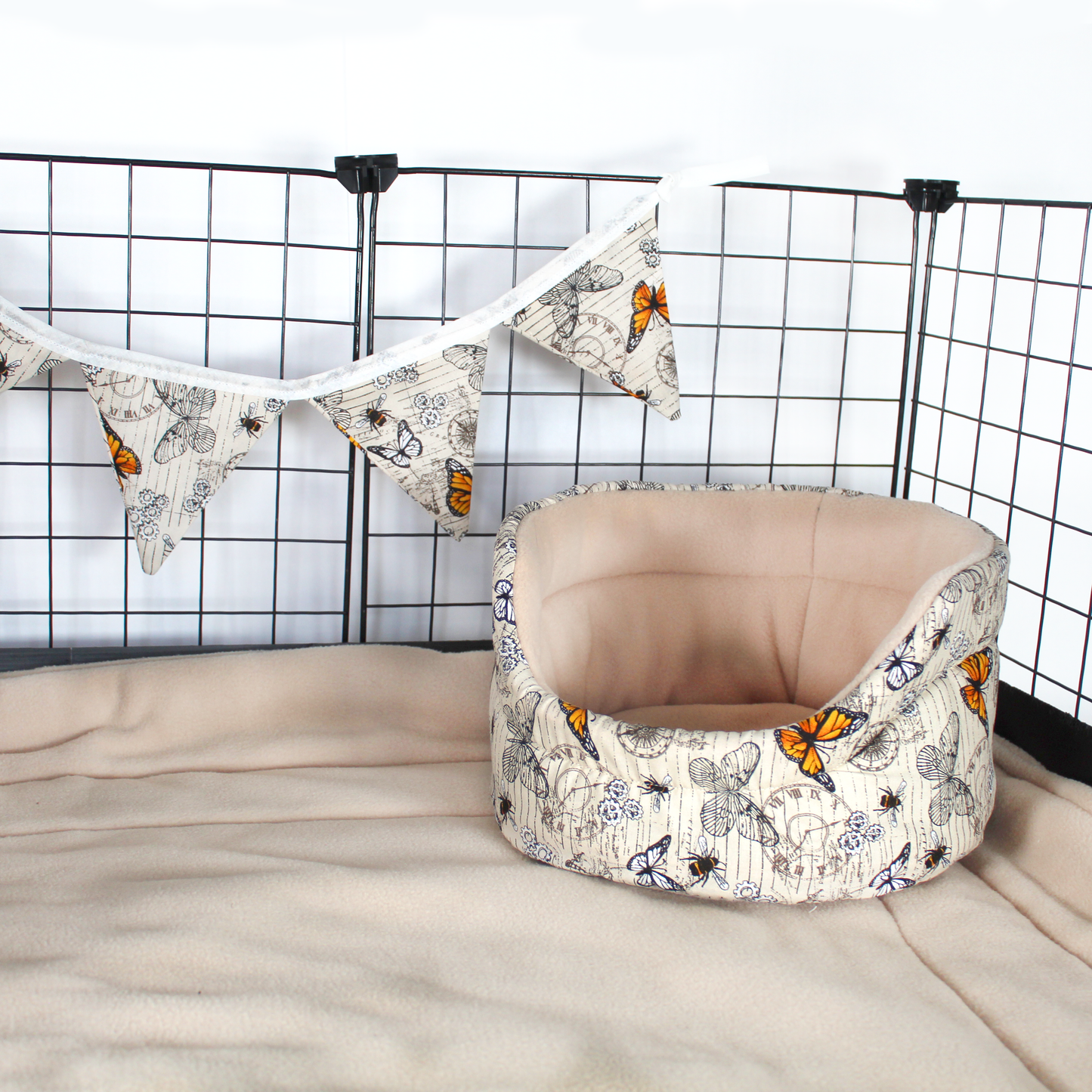 Small Steampunk Butterfly Bunting, hung in a cage with a cuddle cup bed in the same pattern