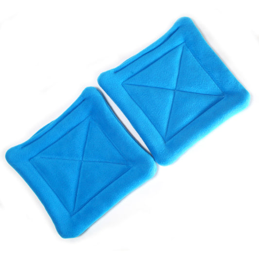 Pair Of Rich Blue Square Pee Pads, above view showing the guinea pig pee pads side by side