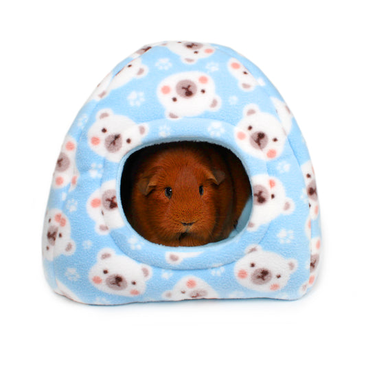 Small animal house with a guinea pig peeking out, featuring a pattern of white animals on a blue background.