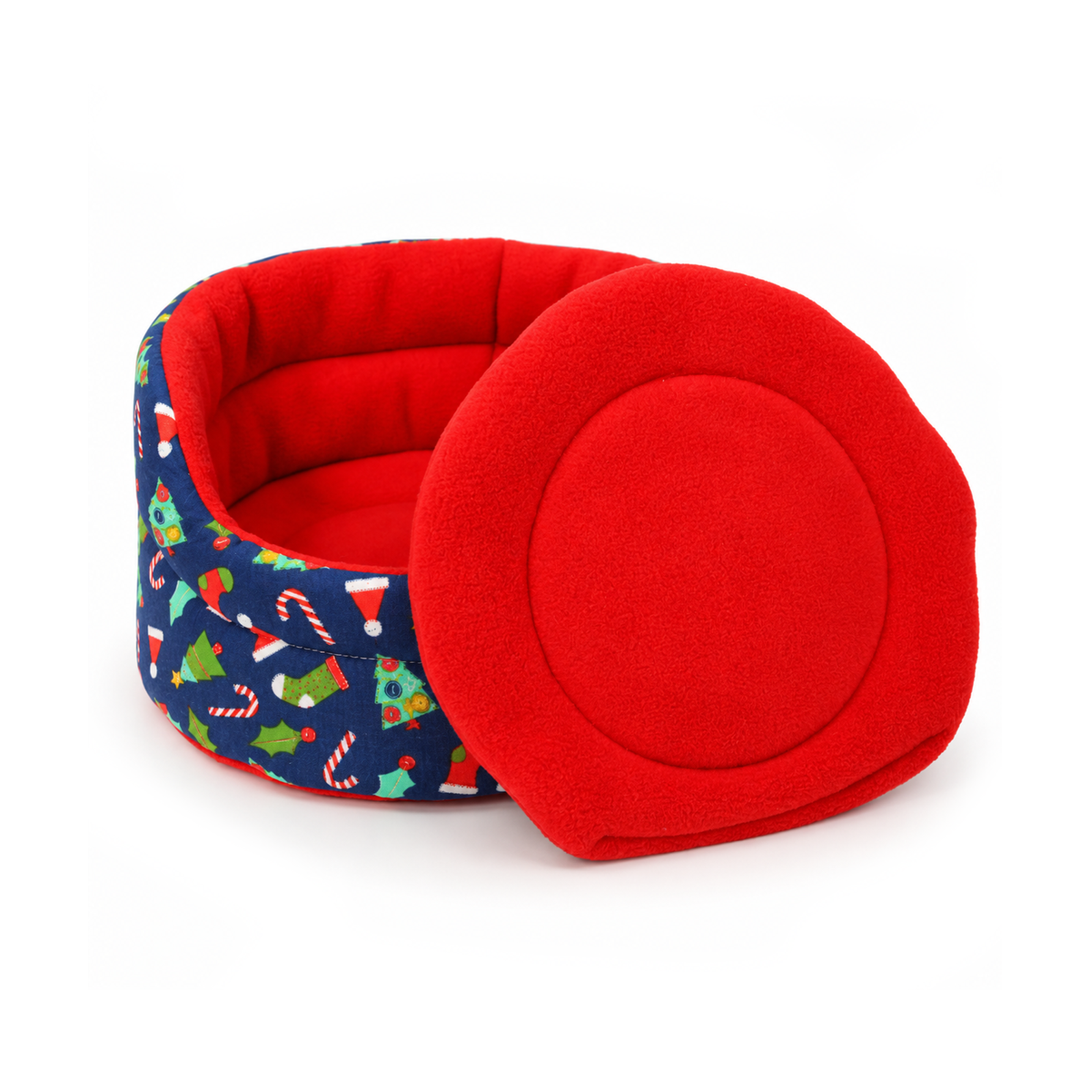 Blue Christmas guinea pig cuddle cup with a matching red absorbent pee pad displayed beside the bed
