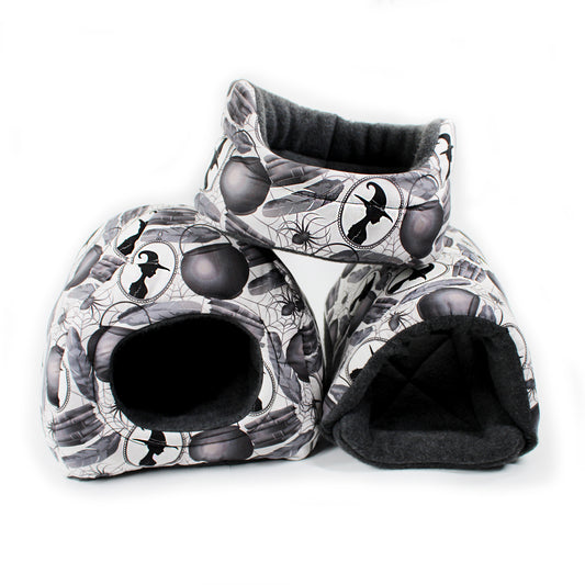 Two cat houses with a Halloween-themed pattern on a white background