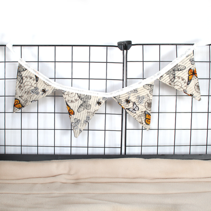 Small Steampunk Butterfly Bunting, hung from a guinea pig cage