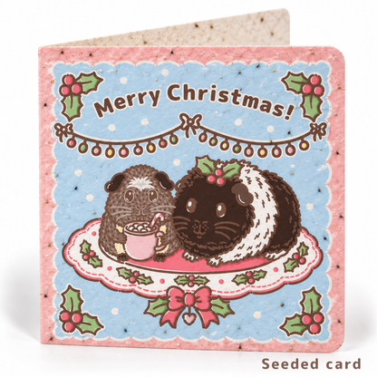 Seeded Christmas guinea pig card featuring Twiglet and Pudding with visible wildflower seeds in the paper