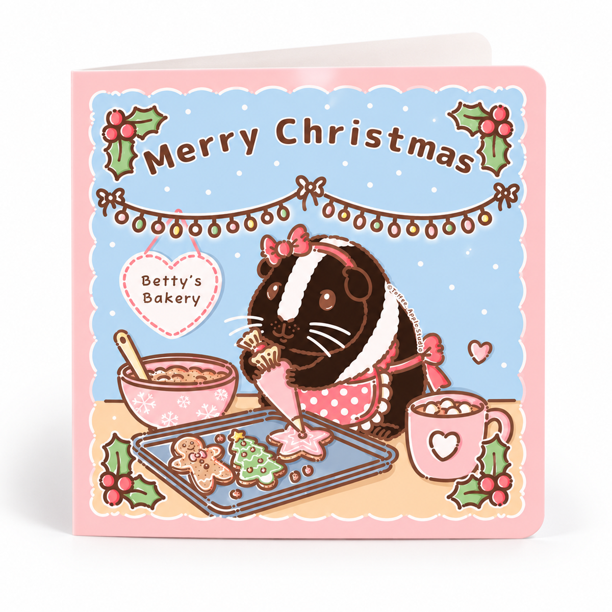 Christmas guinea pig card featuring Betty Crocker baking festive gingerbread biscuits in a Christmas kitchen