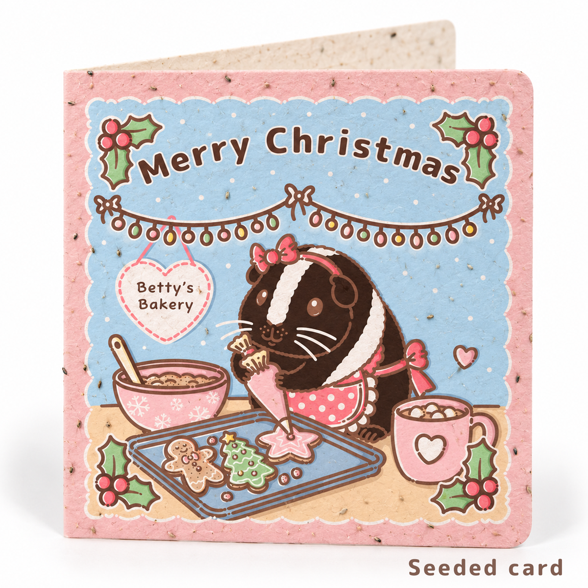 Seeded Christmas guinea pig card featuring Betty Crocker baking gingerbread biscuits, with visible seeds in the paper