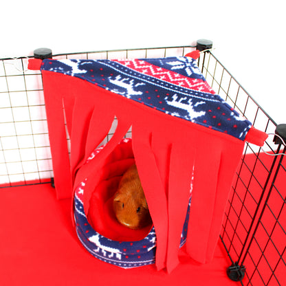 Pet cage with red and blue patterned cover and circular bed inside