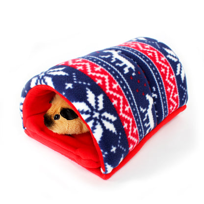 Small animal peeking out from a red and blue patterned tunnel on a white background