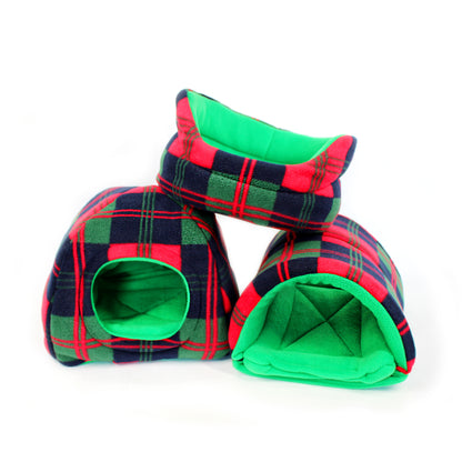 Plaid pet bed with green interior on a white background