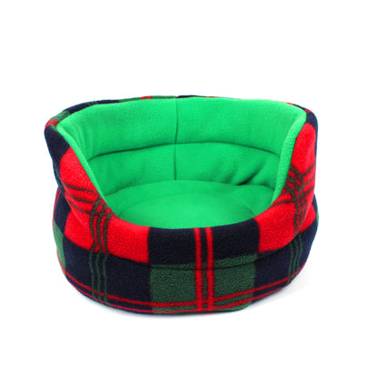 Pet bed with green interior and plaid exterior on a white background