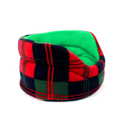 Plaid patterned pet bed with green, red, and black colors on a white background