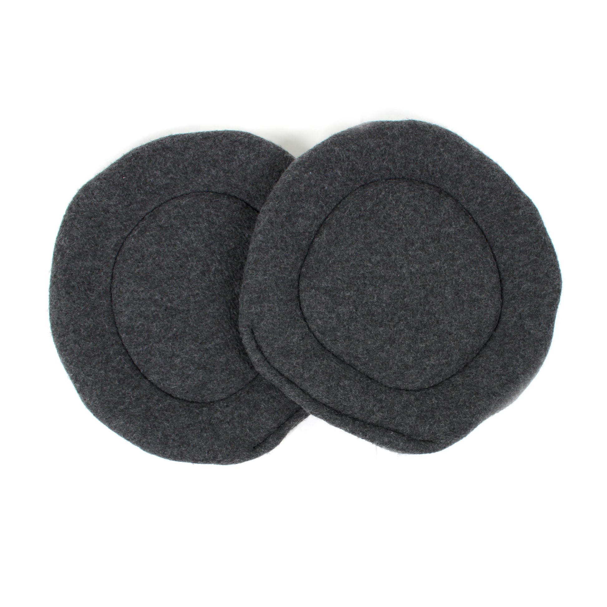 Two gray fleece pee pads on a white background