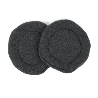 Two gray fleece pee pads on a white background