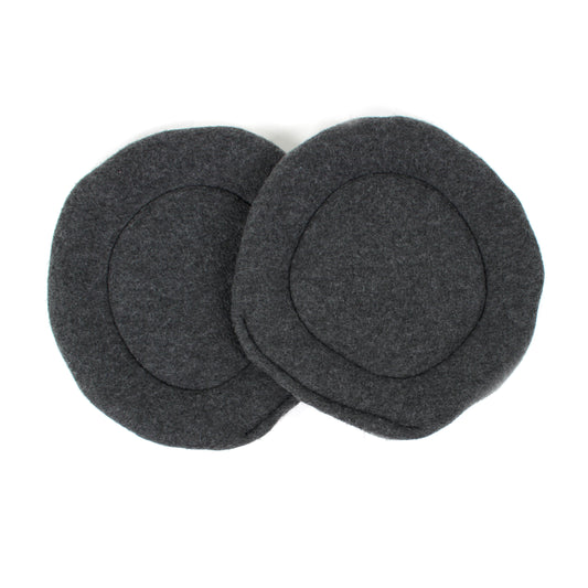 Two gray fleece pee pads on a white background