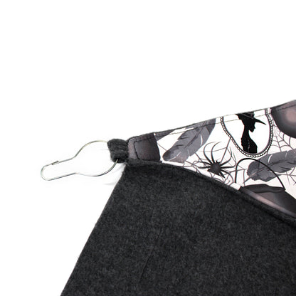 Black fabric with a spider web pattern on a white background