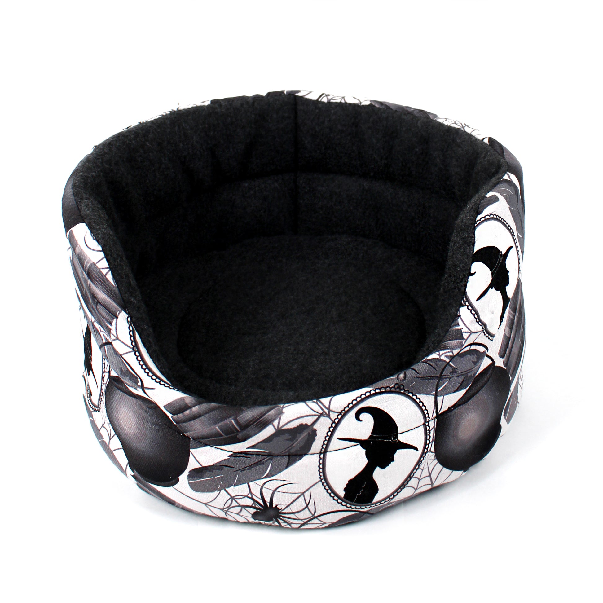 Halloween-themed pet bed with black and white design on a white background