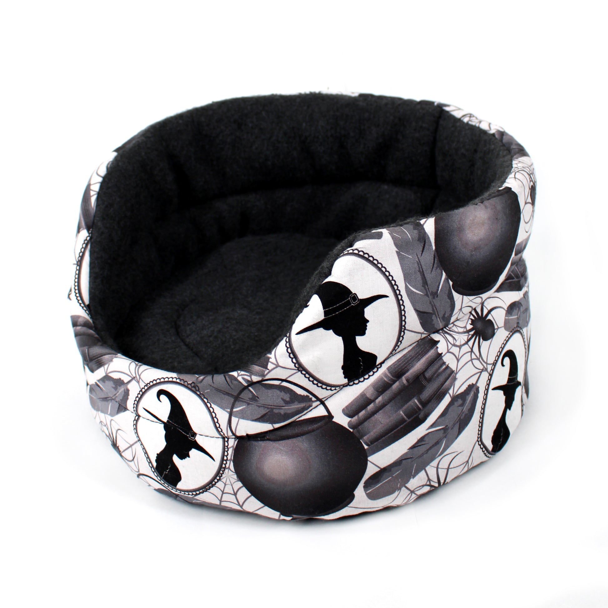 Halloween-themed pet bed with black and white design on a white background