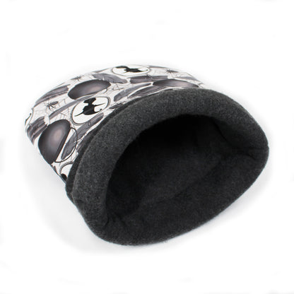 Black pet bed with white pattern on a white background
