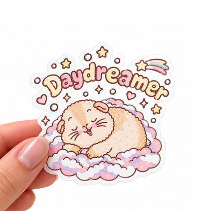 Halloumi the Daydreamer guinea pig sticker held in hand