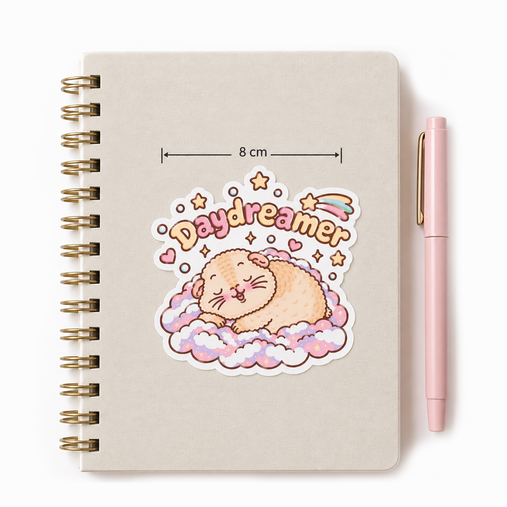 Halloumi the Daydreamer guinea pig sticker on a spiral notebook