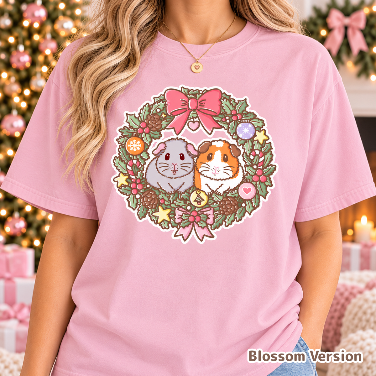 Model wearing the pale pink Christmas guinea pig wreath T-shirt.