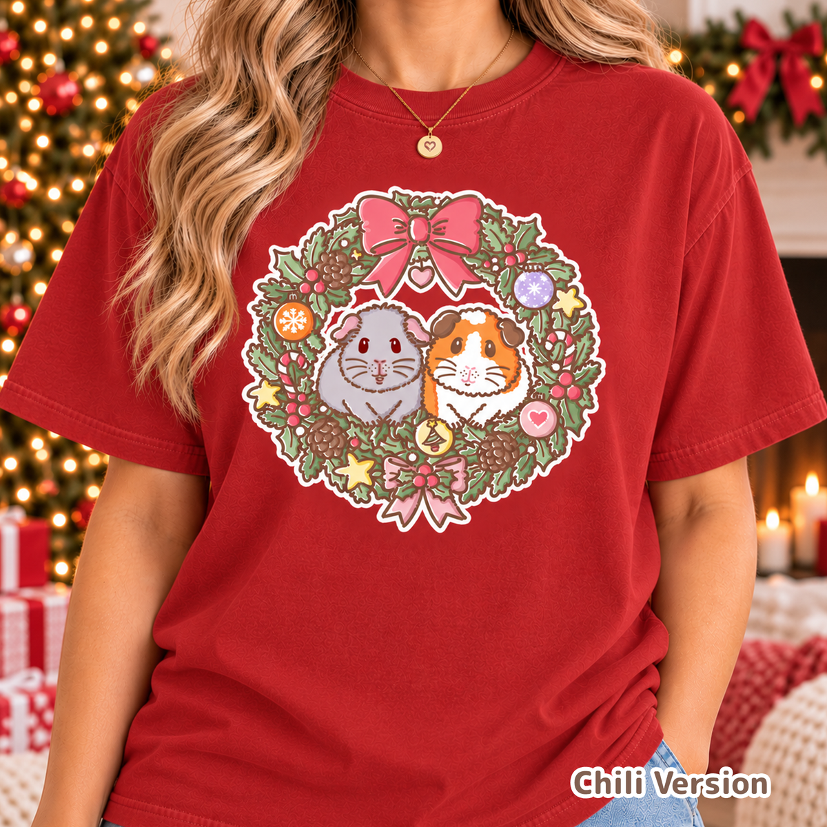 Model wearing the red festive guinea pig T-shirt with Earl Grey and Teacake artwork.
