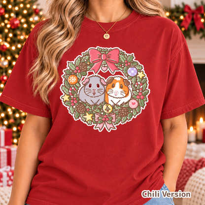Model wearing the red festive guinea pig T-shirt with Earl Grey and Teacake artwork.